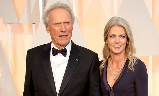 HOLLYWOOD, CA - FEBRUARY 22: (L-R) Clint Eastwood (L) and Christina Sandera arrive at the 87th Annual Academy Awards at Hollywood & Highland Center on February 22, 2015 in Los Angeles, California. (Photo by Dan MacMedan/WireImage)