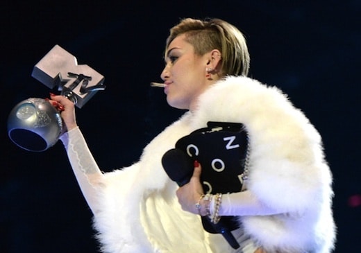 AMSTERDAM, NETHERLANDS - NOVEMBER 10: Miley Cyrus accepts award onstage during the MTV EMA's 2013 at the Ziggo Dome on November 10, 2013 in Amsterdam, Netherlands. (Photo by Kevin Mazur/WireImage)